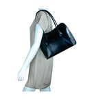 Model wearing black handbag